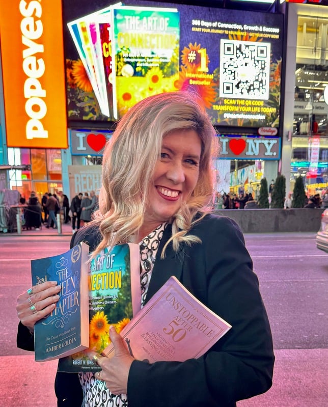 Amber Golden holding her books in Times Square